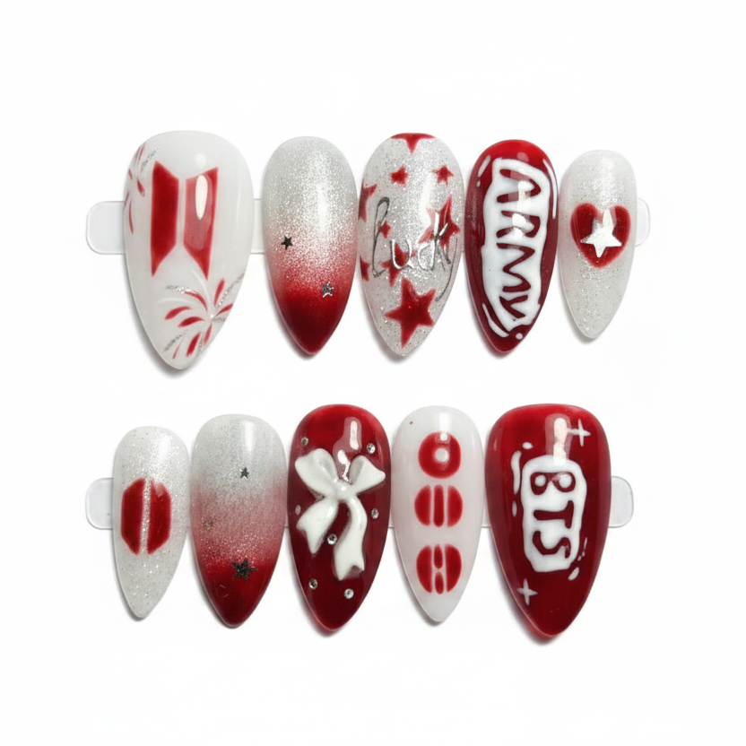 Nail art display with red and white designs on a gray background