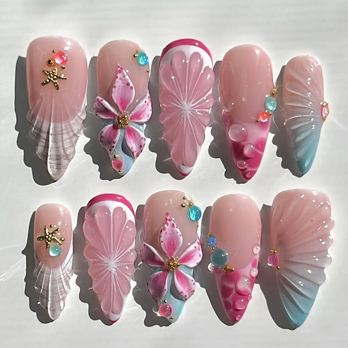 Decorative nail art with pink and white designs