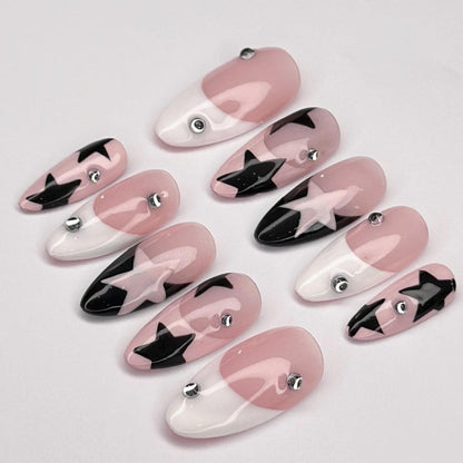 Set of pink, black, and white nail art designs on a light gray background