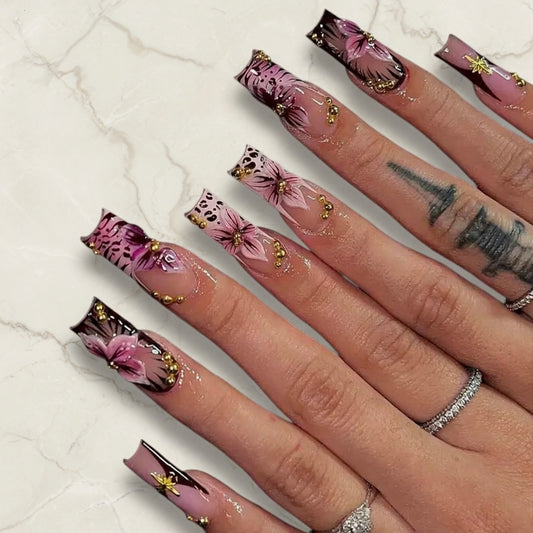 Nails with floral design on a marble background