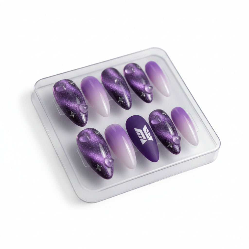 Set of purple and white gradient nails in a clear plastic case against a cosmic background